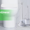 A white toilet features a mounted plunger and brush set with a holder for simplified cleaning.