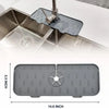 A silicone kitchen sink mat with a faucet splash guard is shown being used in a stainless steel sink.