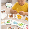 A child is using wooden letter blocks and cards to practice fine motor skills and spelling.