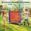 A family playing a red and blue outdoor party game set featuring a basketball hoop and ring toss targets.
