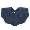 A navy blue knitted baby bib in a bandana style with a cutout for the neck.