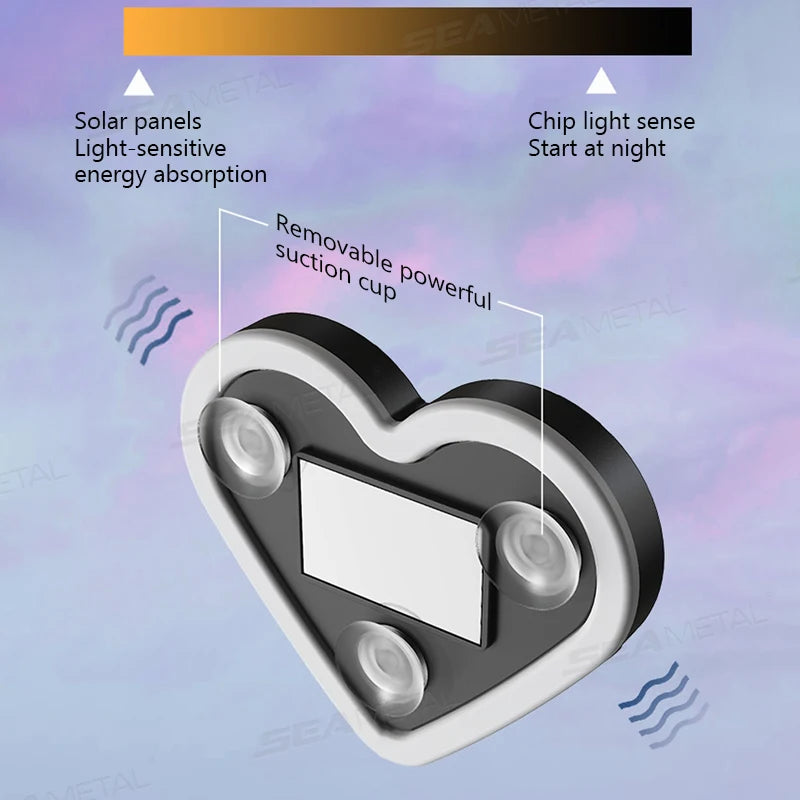 A heart-shaped solar-powered light fixture with a removable suction cup, designed for ambient lighting.