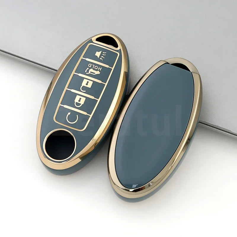 A close-up view of a durable TPU car key case cover for Nissan and Infiniti models, shown in a light blue-gray color.