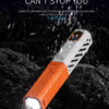 An orange and white LED flashlight is shown being used in a rainy outdoor environment.