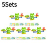 Five sets of frog balance math learning toys featuring green frogs and numbered discs.