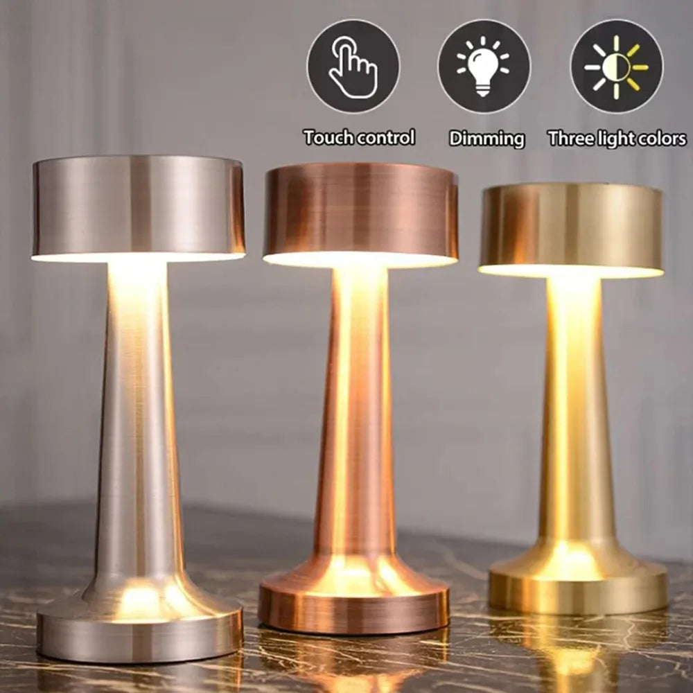 Three modern metal LED table lamps shown in silver, rose gold, and brass finishes with touch control features