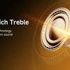 Close-up of a black headphone driver emitting light, highlighting deep bass and rich treble sound technology.