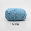 A ball of soft light blue 4-ply milk cotton yarn for knitting and crochet.