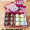 A box of crispy handmade ball stress toys in pink and white colors with a 'Have a nice day' message.