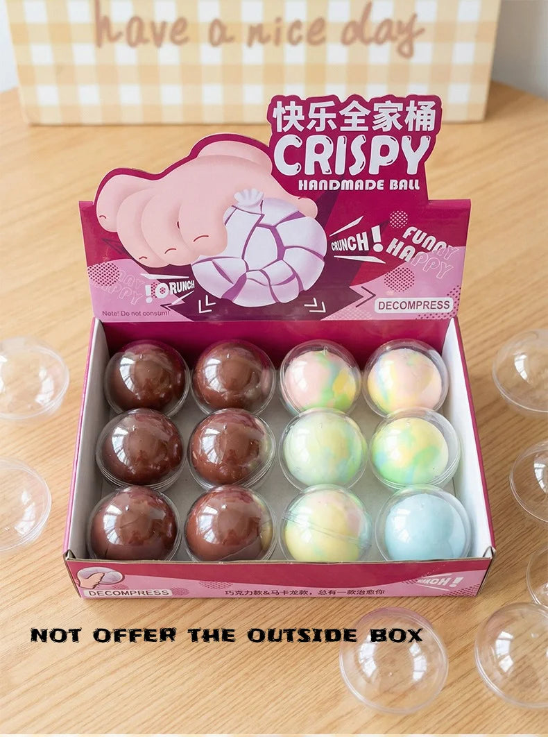 A box of crispy handmade ball stress toys in pink and white colors with a 'Have a nice day' message.