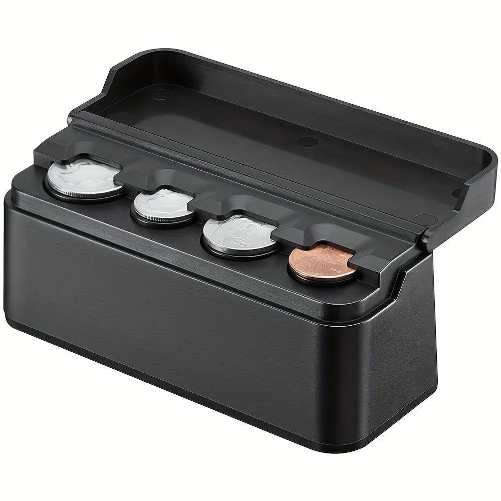 A black car coin storage box with four slots for organizing coins and small items.