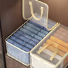 Clear mesh storage bags for clothes blankets and bedding stacked in a wooden drawer.
