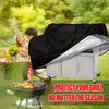 A silver waterproof barbecue grill cover is shown protecting a grill outdoors in a sunny park setting.