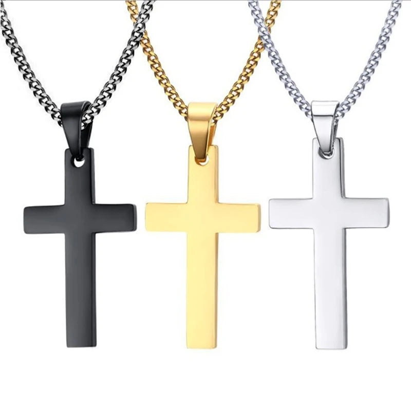 Three stainless steel cross pendant necklaces in black gold and silver finishes