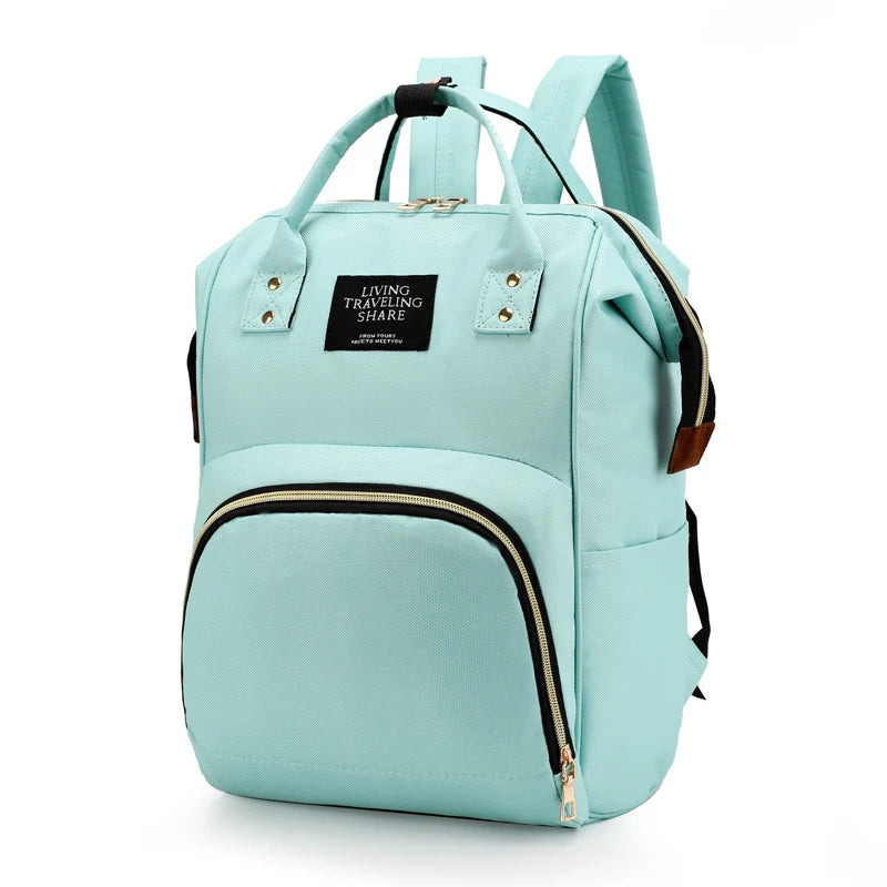 Light blue insulated canvas diaper bag with a black zipper and hanging hook.