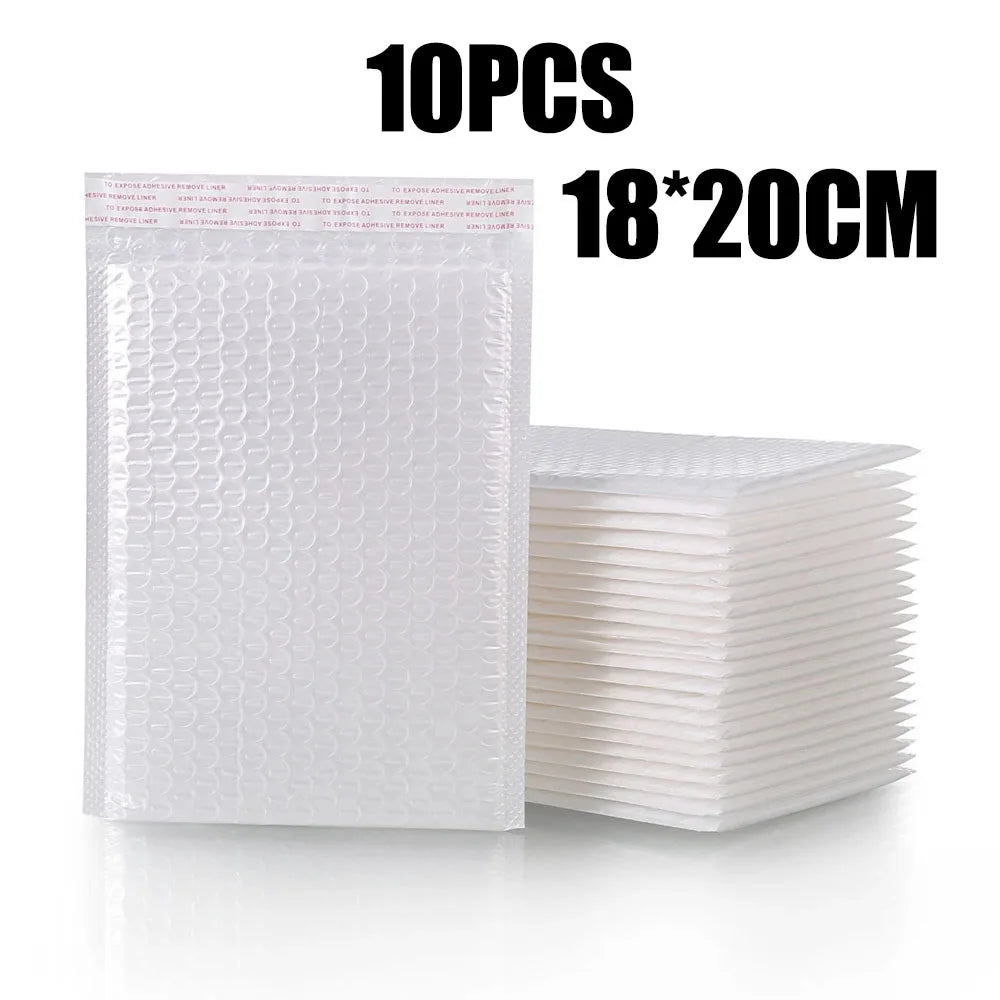 A stack of 10 white padded bubble mailers measuring 18x20cm.
