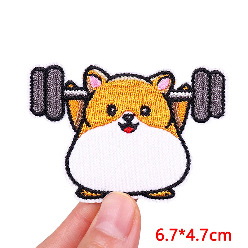 Embroidered iron-on patch featuring a cute orange and white cartoon dog face