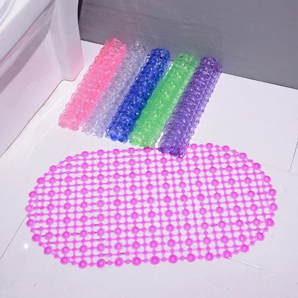 A collection of colorful non-slip PVC bath mats with suction cups arranged in a row and a circular pattern.