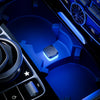 A close-up view of a car interior showing a blue LED ambient light feature.