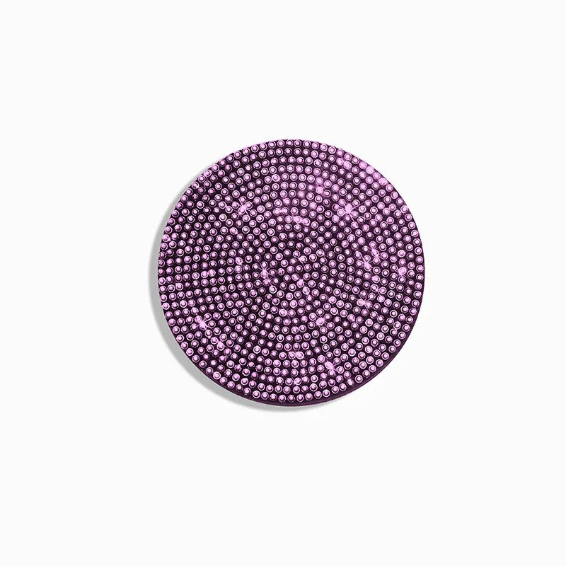 A circular set of two non-slip diamond car cup holder coasters with a purple glitter finish.