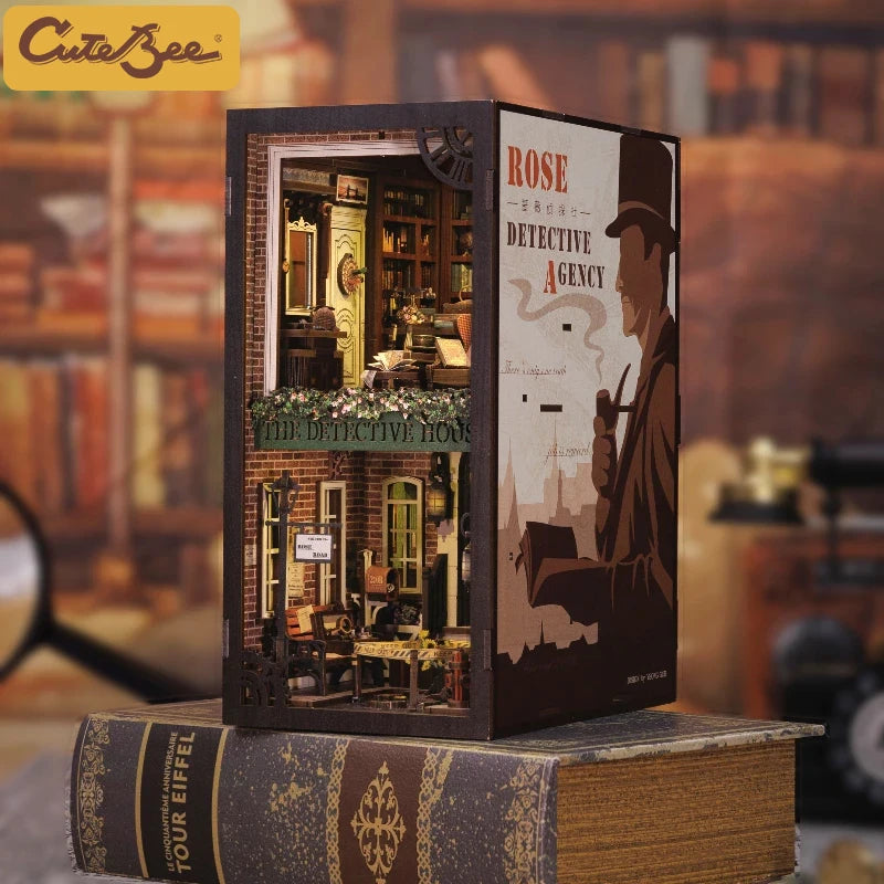 A wooden box kit for a detective house book nook featuring miniature details and LED lighting.