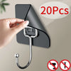 A hand is installing a self-adhesive rotating wall hook onto a dark gray surface, demonstrating its use for storage.