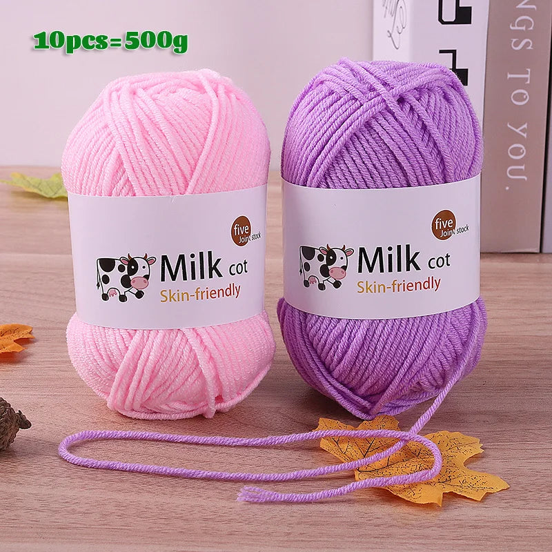 Two skeins of pink and purple milk cot skin-friendly acrylic yarn for knitting and crochet projects