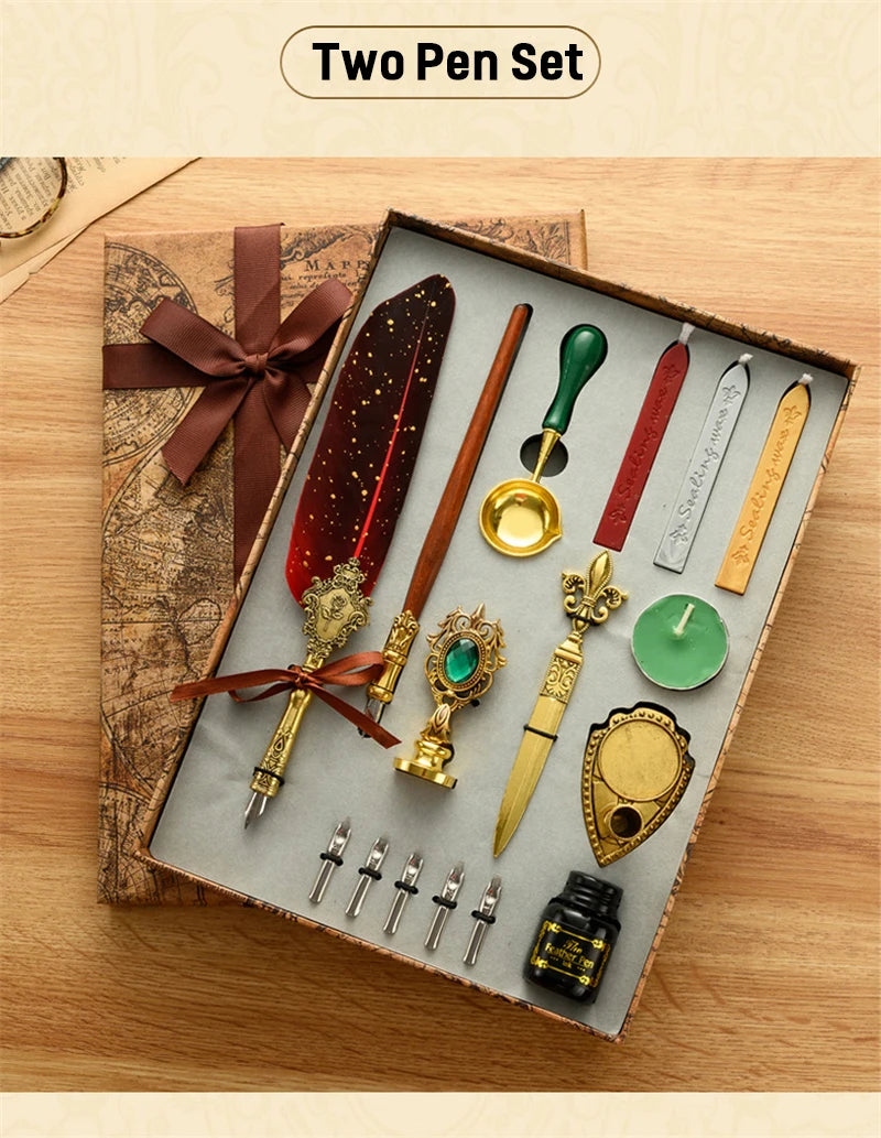 A wooden box contains a two pen set with various fountain pens, a gold seal stamp, and an inkwell on a light gray background.