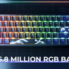 A close-up of a compact mechanical keyboard with custom art keycaps and vibrant RGB backlight on a dark surface.