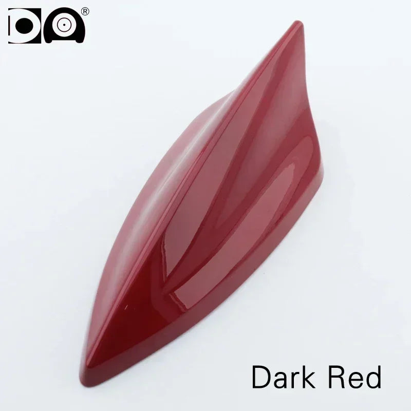 A glossy, dark red 5D shark fin car antenna painted in piano paint.