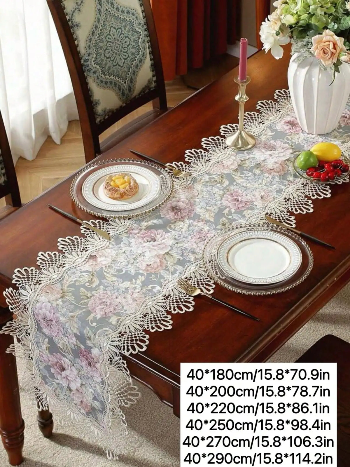 A long table runner with floral lace detail is displayed on a wooden table.