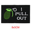 Black embroidered iron-on letter patch featuring a green bottle and the text I PULL OUT