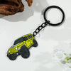 A yellow Ford Bronco zinc alloy keychain attached to a black chain, photographed on a white surface.
