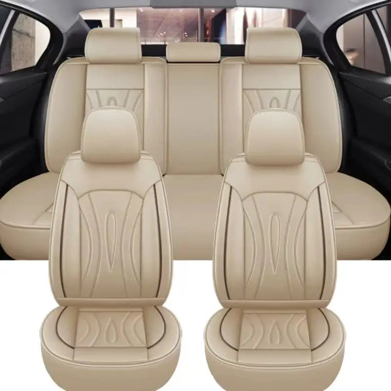 Light beige full coverage PU leather car seat covers shown in a vehicle interior.