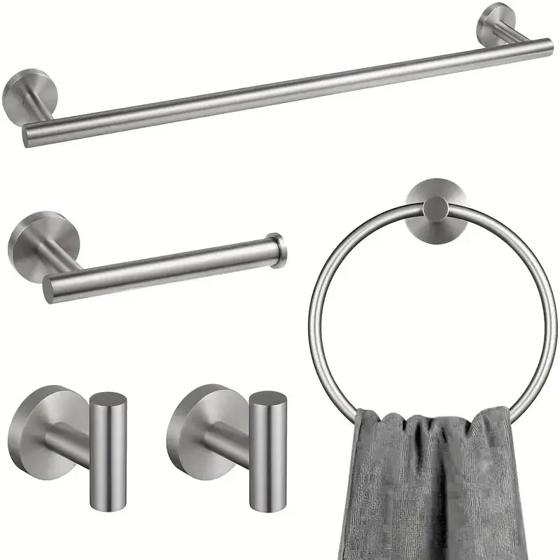A set of four stainless steel bathroom accessories including a toilet paper holder, towel ring, and hooks.