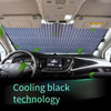 Interior view of a car showing a cooling black technology retractable windshield sunshade deployed.