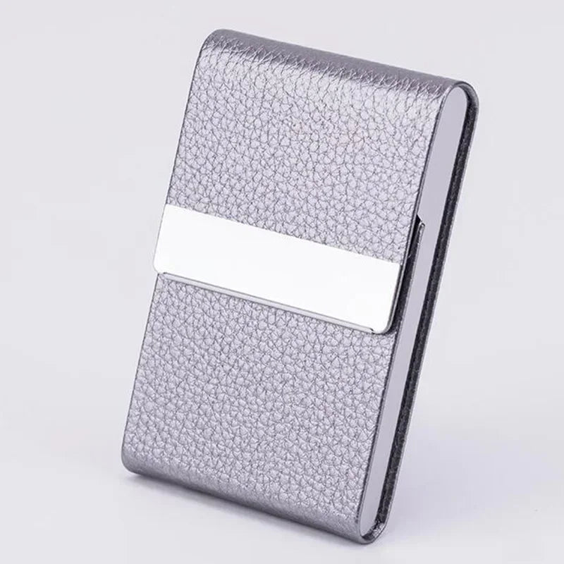 A silver textured card holder with a white accent strip, made of slim PU leather and stainless steel.