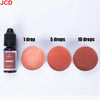 A set of garnet colored liquid candle dye in various drop quantities, including 1, 5, and 10 drops.