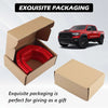 A red front tow hook cover for a RAM 1500 truck is shown in various packaging forms.