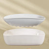 A white double-layer draining soap dish is shown floating above a hand, highlighting its moisture-proof design.