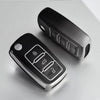 A black soft TPU car key cover for VW, Skoda, and Seat vehicles shown on a white surface.