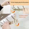 Hands are installing an over-the-door organizer rack with hooks onto a glass surface.