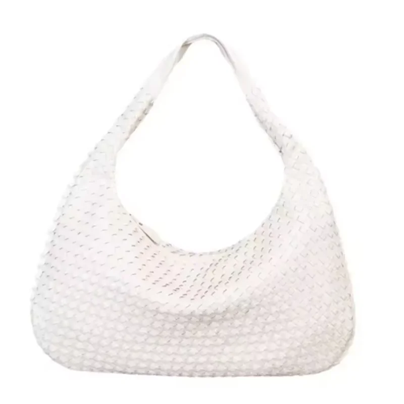 A white vegan leather woven hobo bag with a drawstring closure.