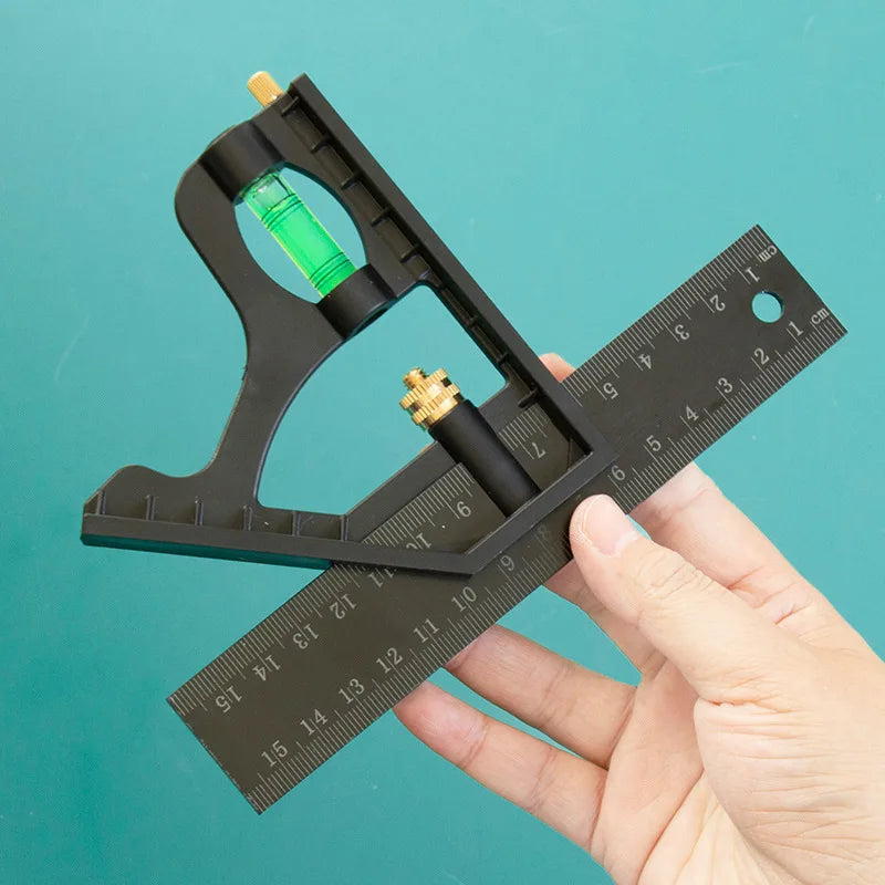 A hand holds a black multifunctional carpenter square with an angle level and protractor tool against a teal background.
