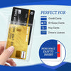 A hand holds a clear waterproof ID card holder containing various cards like credit cards and driver's licenses.
