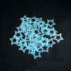 A scattered pile of light blue glow-in-the-dark 3D star wall stickers for kids' rooms.
