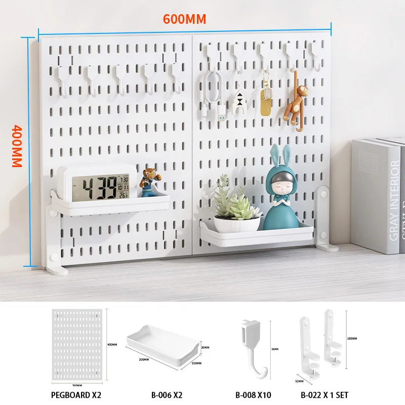 A white desktop pegboard organizer featuring multiple hooks and shelves for various items like tools and decorative objects.
