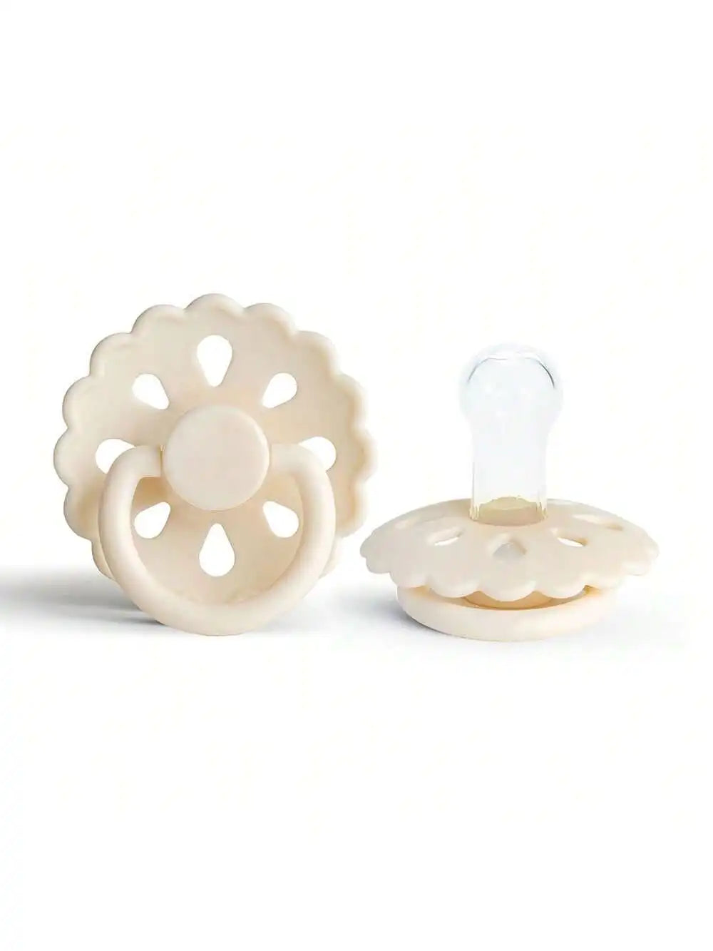 A white silicone baby pacifier with a flower-like design and a clear silicone nipple.