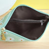 A light green PU leather wristlet wallet with a zipper closure and daisy print pattern shown open.
