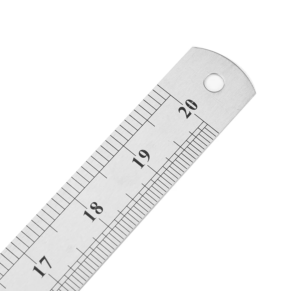 A stainless steel precision straight ruler showing markings from 17 to 20.
